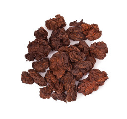 Dried puer tea heap isolated on a white background. Top view.