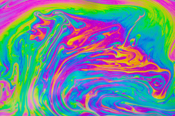 Psychedelic multicolored patterns background. Photo macro shot of soap bubbles