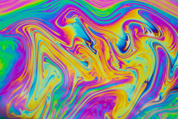 Psychedelic multicolored patterns background. Photo macro shot of soap bubbles