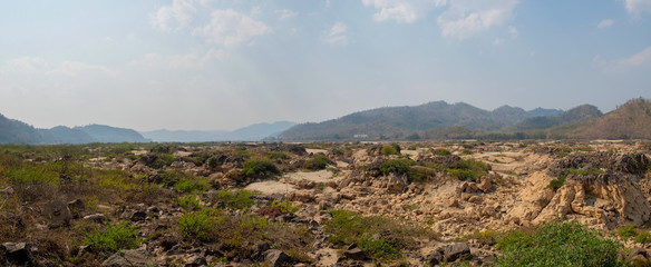 Panoramic view of the Mekong River that is dry until you see rocks.