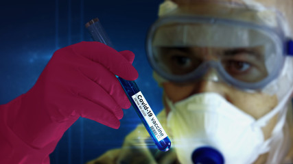 Scientist in mask with test-tube and Covid-19 virus test