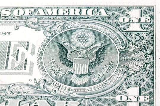 Detail of one dollar bill. US cash banknote money dollars background. Top view, macro photo close up