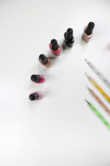 Nail art concept. Woman making manicure on white background