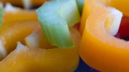 healthy sliced fresh celery and pepper in close-up