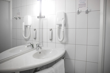 Interior of stylish and elegant bathroom in hotel. Private apartment. Water relaxation treatments and spa at home. Minimalistic design in light shades