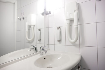 Interior of stylish and elegant bathroom in hotel. Private apartment. Water relaxation treatments and spa at home. Minimalistic design in light shades