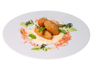Dish with cutlets on a white background.