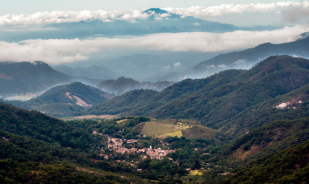 Looking at the Mexican Town of El Tuito from La Bufa in a Forested Landscape, Jalisco, Mexico