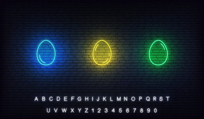Easter neon eggs set. Glowing blue, yellow, green eggs icons with alphabet