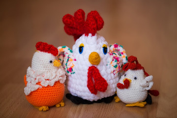 Symbol of the year 2017, the year of the rooster. Knitted cock, isolate. Textile decoration for interior design or Christmas tree. Perfect for a gift.