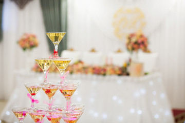 Slide glasses of champagne with a cherry on the wedding party. Ice cold.