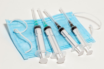 several syringes on the white background