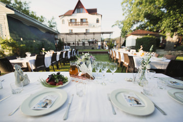 Serving a wedding Banquet on the street against the background of the castle.