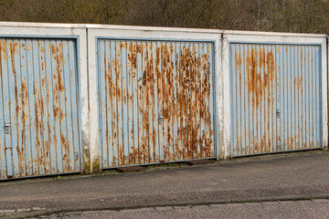 rusty iron garage doors rotten side by side