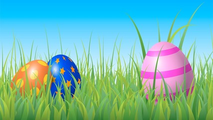 Colorful easter eggs hidden in the grass in the meadow