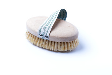 Natural wooden brush on a white background