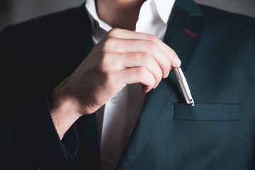 man hand pen in suit pocket