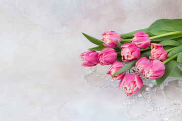 bouquet of pink tulips and glass beads