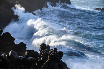 Dangerious ocean stormy waves hits black lava rocks on La Palma island, Canary, Spain