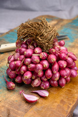 Bunch of small red shallot sambar onions from India
