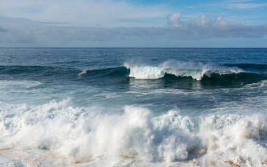 Dangerious ocean stormy waves hits black lava rocks by Faro de las Hoyas, La Palma island, Canary, Spain