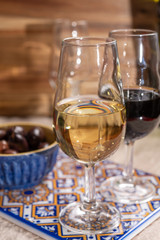 Fortified wine from Andalusia, Spain, different types of sherry in glasses and olives, colors of Andalusisa