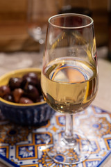 Fortified wine from Andalusia, Spain, different types of sherry in glasses and olives, colors of Andalusisa