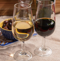 Fortified wine from Andalusia, Spain, different types of sherry in glasses and olives, colors of Andalusisa