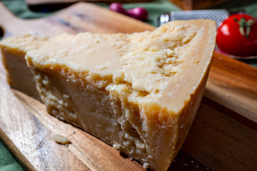 One piece of authentic Parmigiano-Reggiano or Parmesan Italian hard, granular cheese
