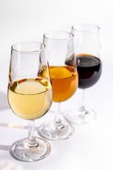 Fortified wine from Andalusia, Spain, different types of sherry in glasses on white background