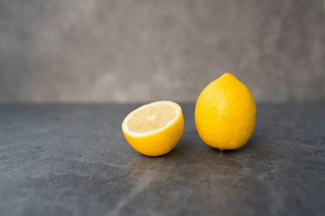 yellow lemon cutaway on a gray background
