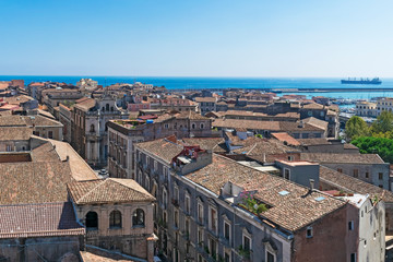 Fototapeta na wymiar Aerial skyline panoramic view of Catania old town featuring brown and yellow roofs. Sicily, Italy 