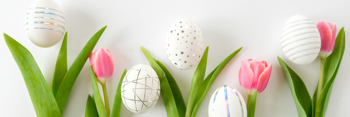 White easter eggs with silver pattern and pink flowers