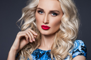 Fototapeta premium woman in blue dress on black background