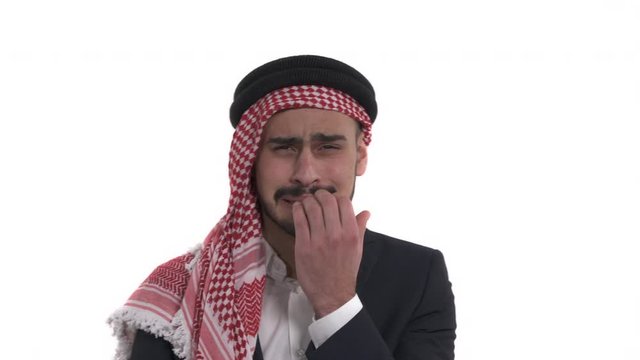 Close-up picture of a scared man biting his nails over white background