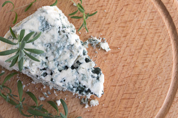 Blue cheese on a wooden serving board.view from above