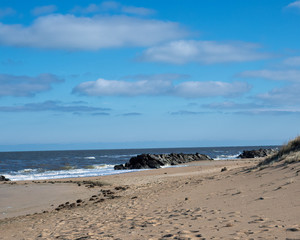 Far away beach rocks