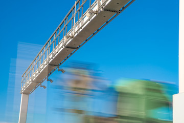 truck passing through a toll gate on a highway toll roads