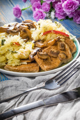 Braised pork loin with mushrooms.