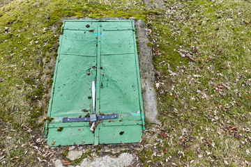 old green door to the bomb shelter