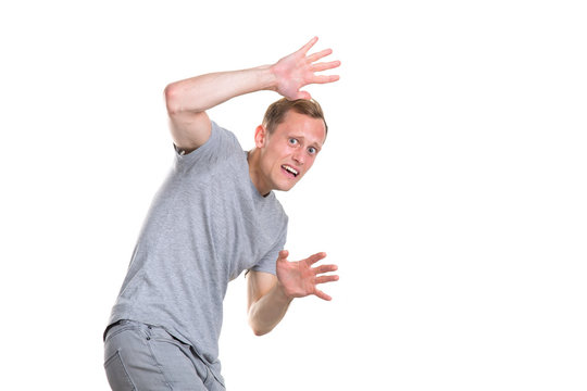 Fear And Horror Emotions Young Man Hiding Behind His Hands, Isolated On A White Background.