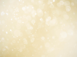 Golden background with soft bokeh lights.