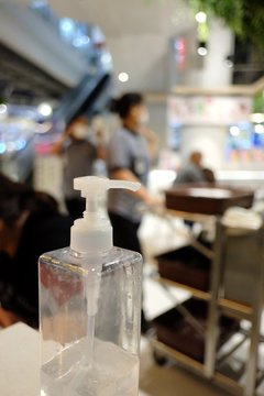 A Bottle Of Clean Hand Alcohol Gel Sanitizer Pump On The Counter At Food Center Area In A Department Store