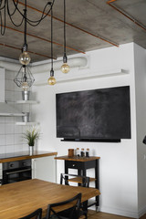 Kitchen hood in Modern, bright, clean, kitchen interior with stainless steel appliances in a luxury house. Kitchen in luxury mansion. Built-in Kitchen appliances ready for comfortable use.