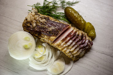 Still life of appetizing bacon with greens