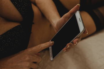 sexy girl or woman with mobile phone