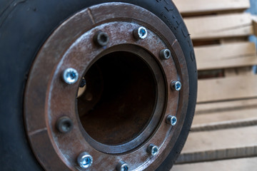 Fototapeta na wymiar homemade metal disk with a go-kart tire