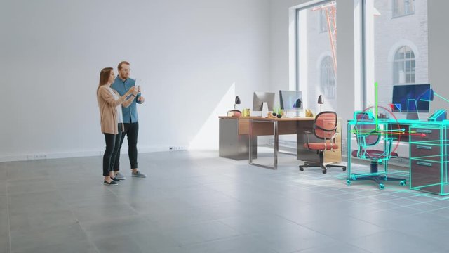In Empty New Office: Female Interior Designer and Male Office Architect Talk, Use Augmented Reality Software on Digital Tablet Computer to Choose, Move and Manipulate 3D Furniture. VFX Special Effects