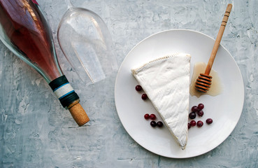 Brie cheese. Food for wine and romance, cheese delicacies. Horizontal menu design. View from above. Place for text.
