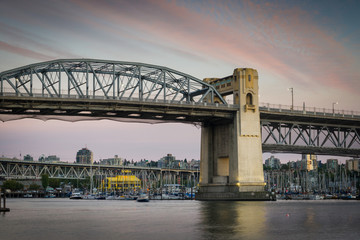 Fototapeta na wymiar The Burrard Street Bridge spans False Creek, connecting Vancouver and Kitsilano, B.C.
